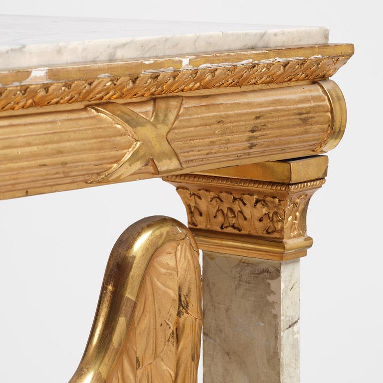 A Swedish Empire gilt wood and white marbel console table.