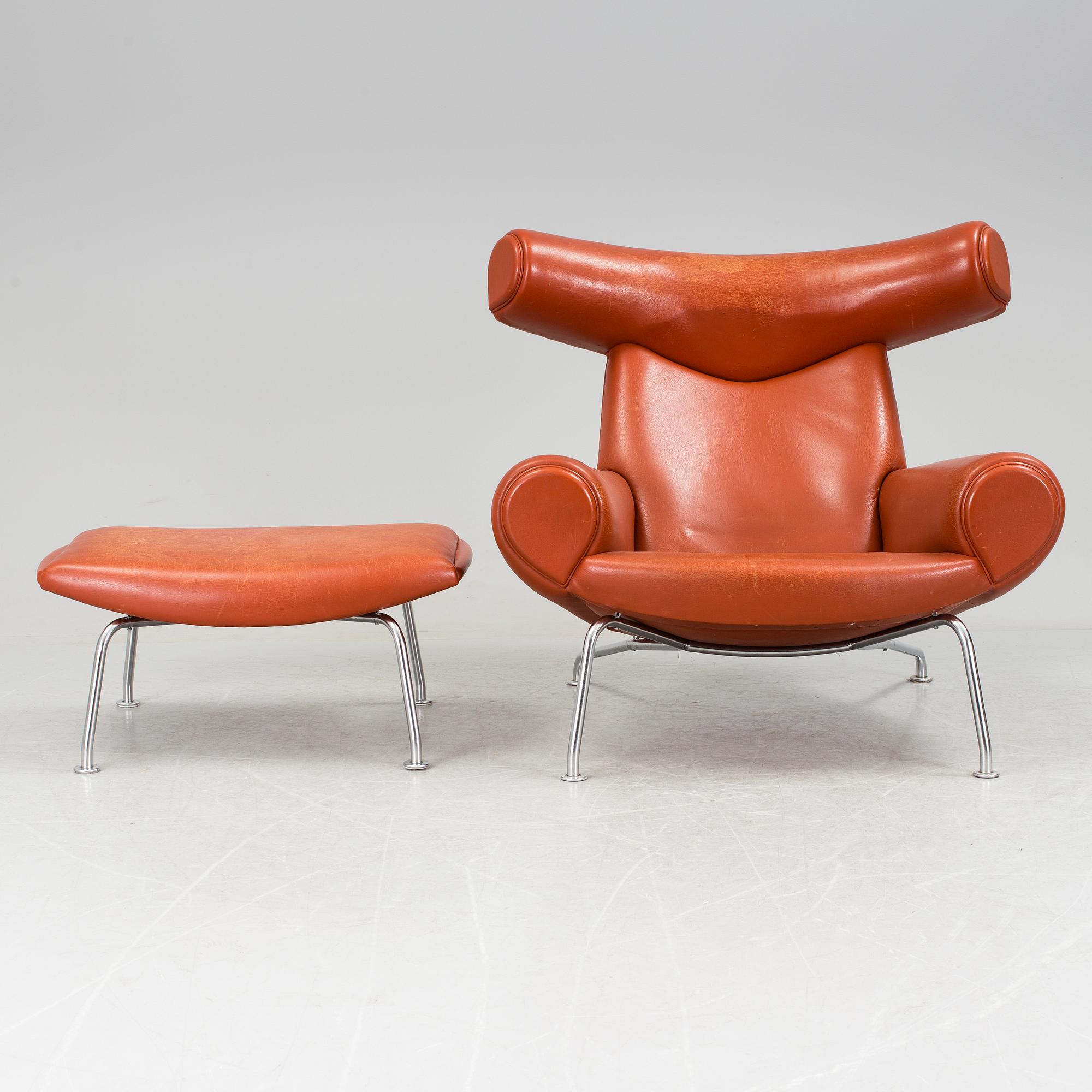 An "Ox-Chair" and foot stool by Hans J Wegner for Erik Jorgensen, Denmark.