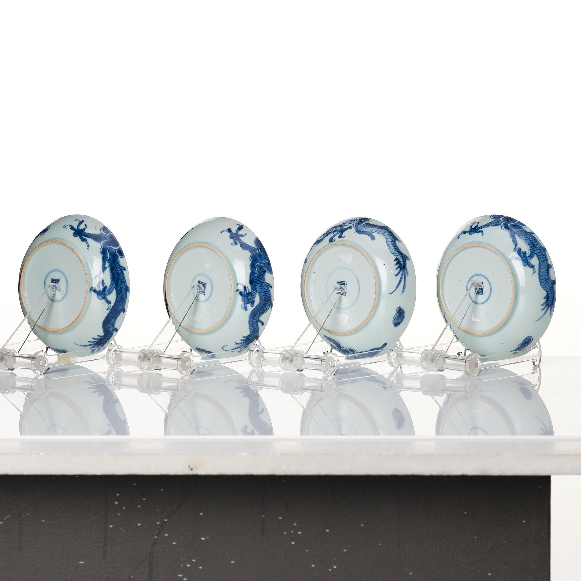 A set of four blue and white dragon dishes, Qing dynasty, 18th Century.