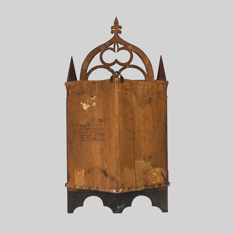 A mid-19th-century wall cabinet.