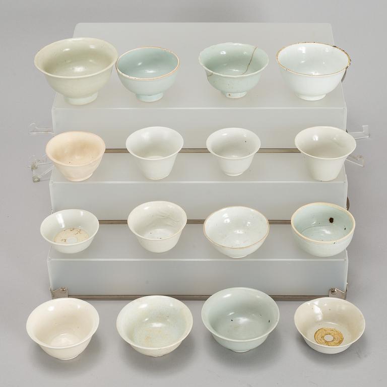 A group of 11 Southeast asian and Chinese white glazed cups, 19th century and also later.