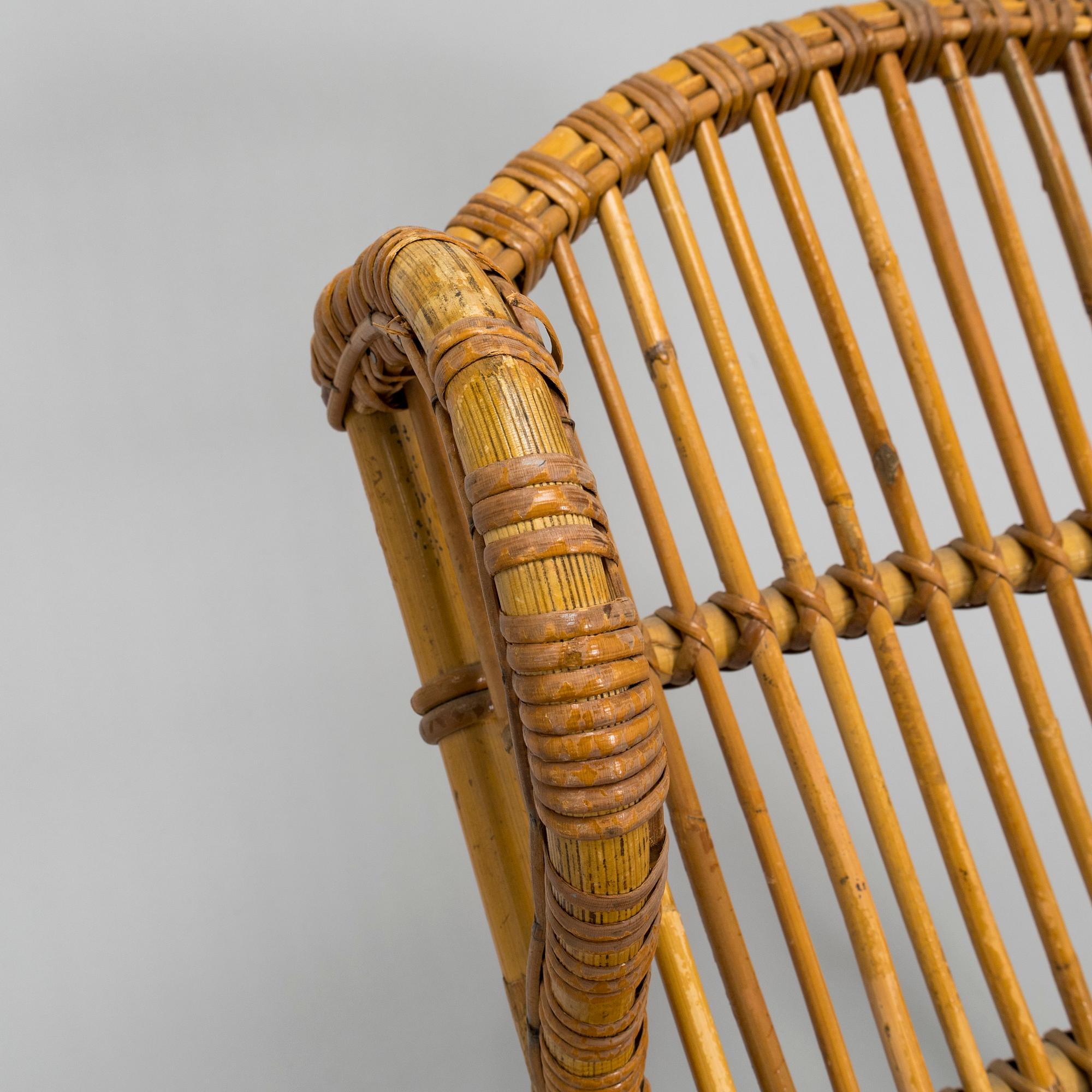 A mid-20th century rattan lounge chair.
