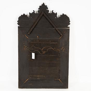 A Baroque style repoussé mirror, circa 1900.