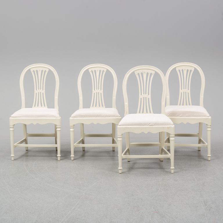 Four early 20th Century painted Gustavian style chairs.