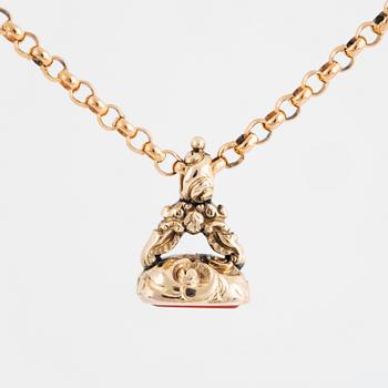 A carnelian seal in a chain.