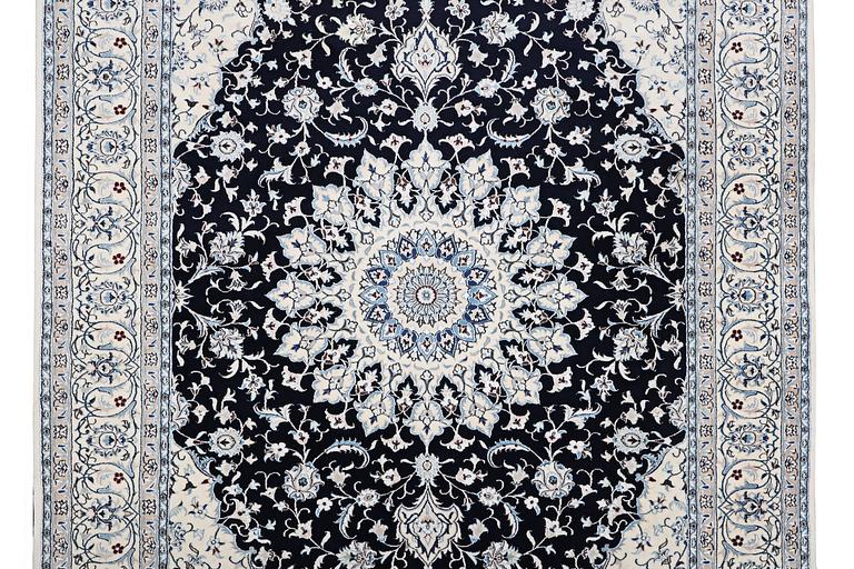 A Nain carpet, part silk, 9 laa, c. 351 x 257 cm.