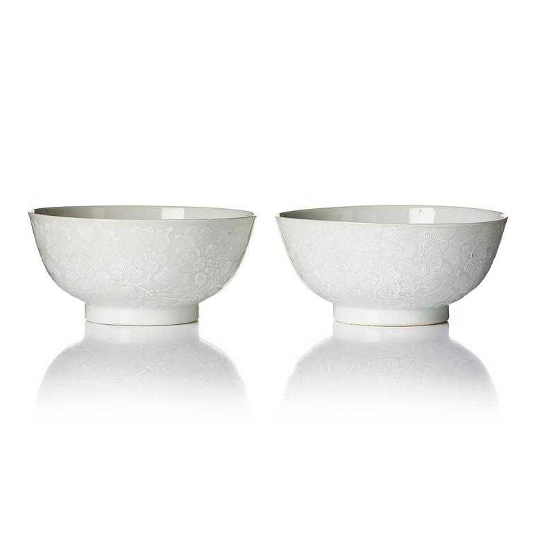 A pair of white glazed lotus bowls, Qing dynasty, 18th century.