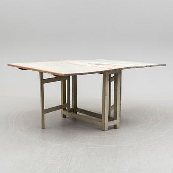 a gate-legged table from the first half of the 19th century.