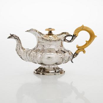 A parcel-gilt silver teapot, Moscow 1845.