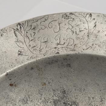 A large pewter charger, Sweden, dated 1701.