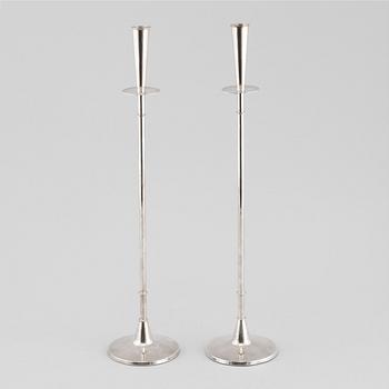 A pair of silver candelsticks by Tore Eldh, K&EX, Gothenburg, 1962.