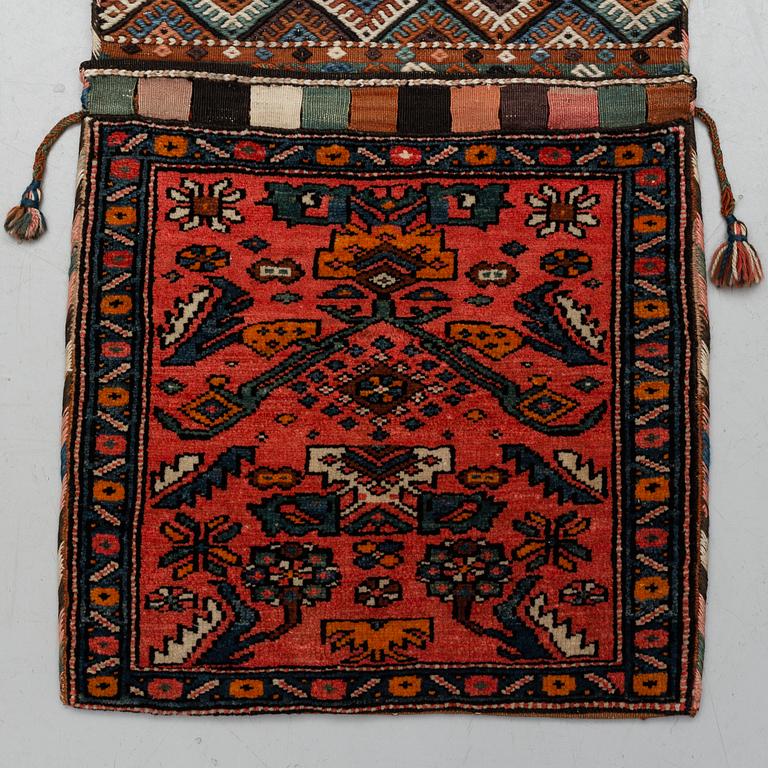 A semi-antique west persian saddlebag, circa 127 x 54,5 cm.