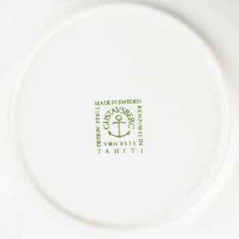 A set of four 'Tahiti' tea cups with plates by Stig Lindberg for Gustavsberg.