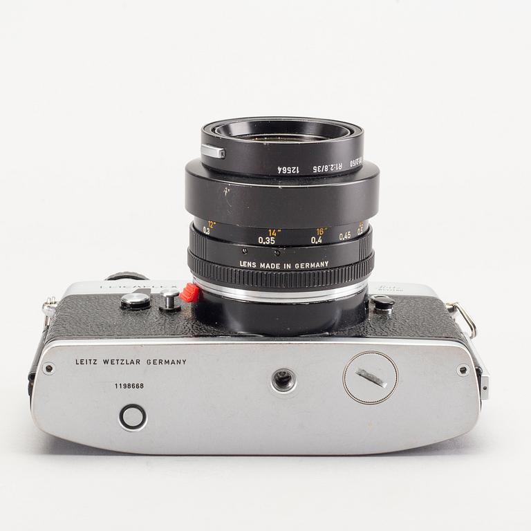 A chrome Leicaflex SL / Leica no 1198668 (1968) and two lenses.