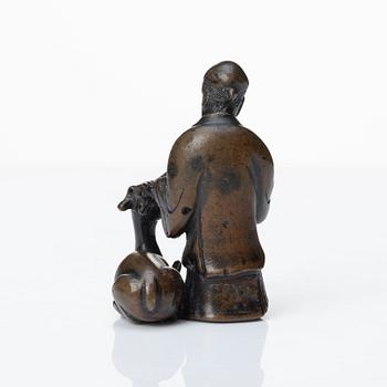 A bronze scultpure of the God of Longevity Sholaou and his deer, Qing dynasty, 18th Century.