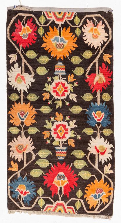 An antique Tibetan rug, Qing dynasty, circa 1900. Measure 173 x90 cm.