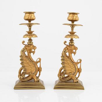 A pair of brass candleholders, 20th century.