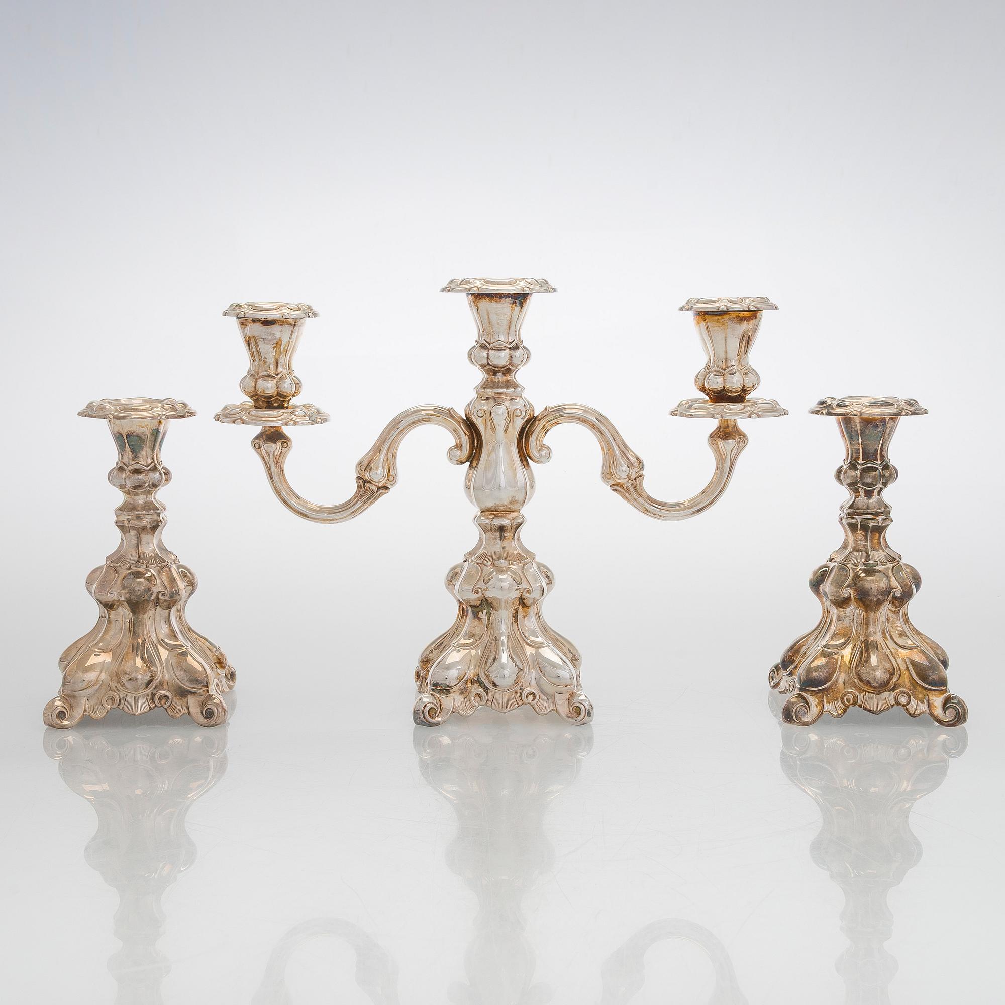 A silver candelabra and a pair of silver candlestick, Kultakeskus Hämeenlinna 1962 and 1985.