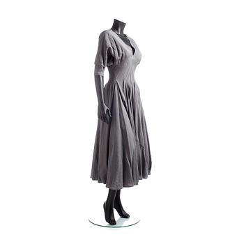 ALAÏA, a grey dress.