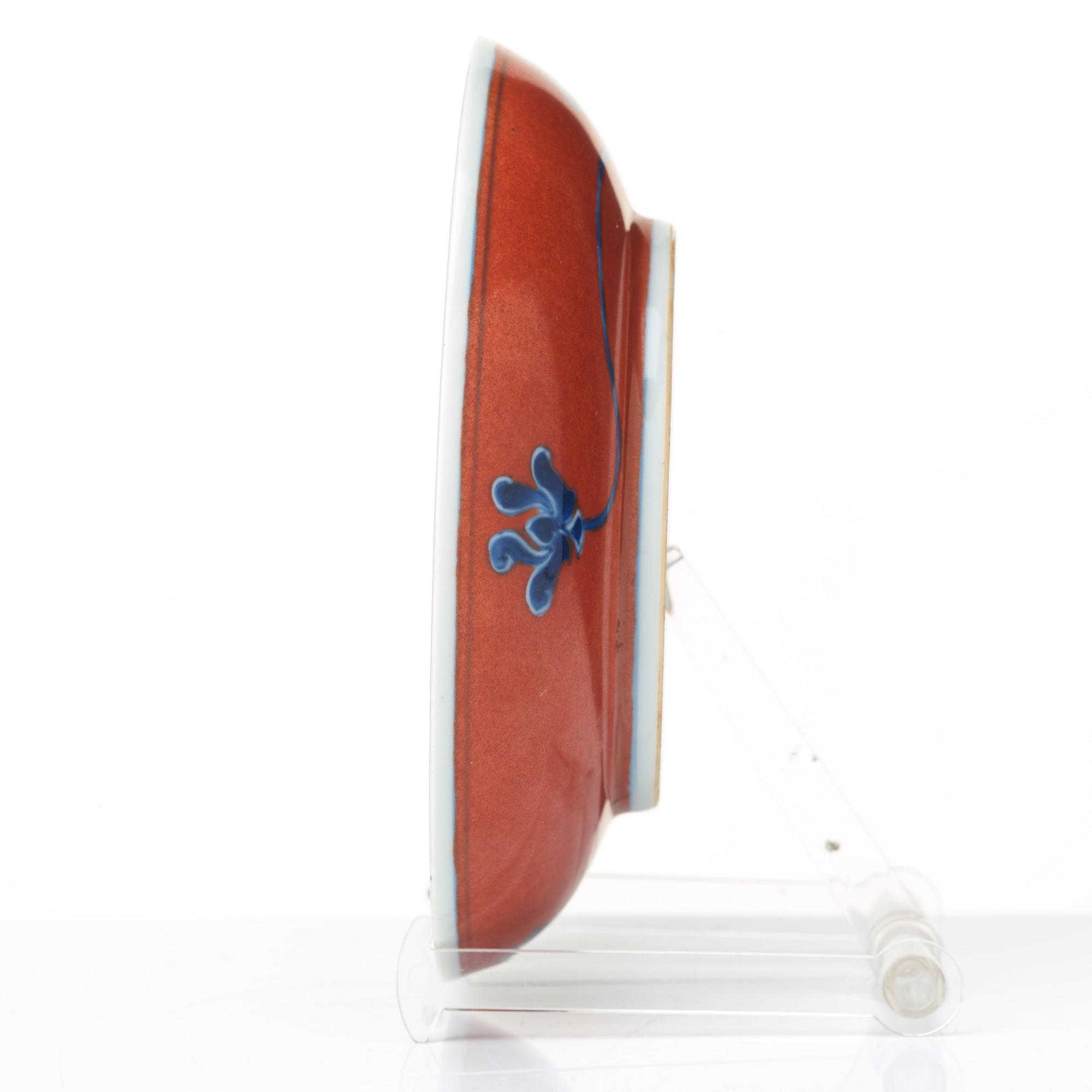 A red glazed dish, 17th Century with Chenghua mark.