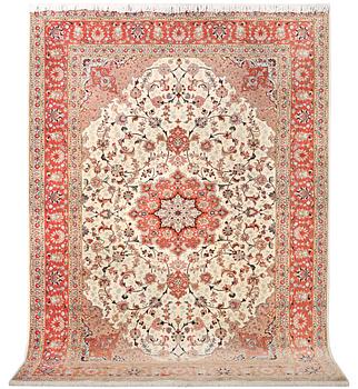 A Tabriz carpet, part silk, 50 raj, c. 304 x 204 cm.