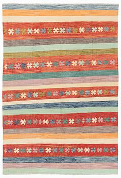 A kilim rug, ca 298 x 208 cm.