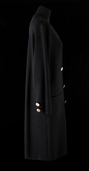 A 1970s black knitted wool coat dress by Yves Saint Laurent.