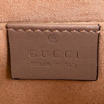 Gucci, a shoulder bag.