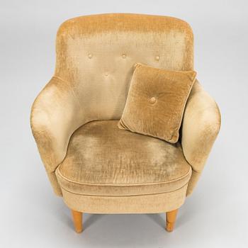 A mid-20th-century sofa and armchair.
