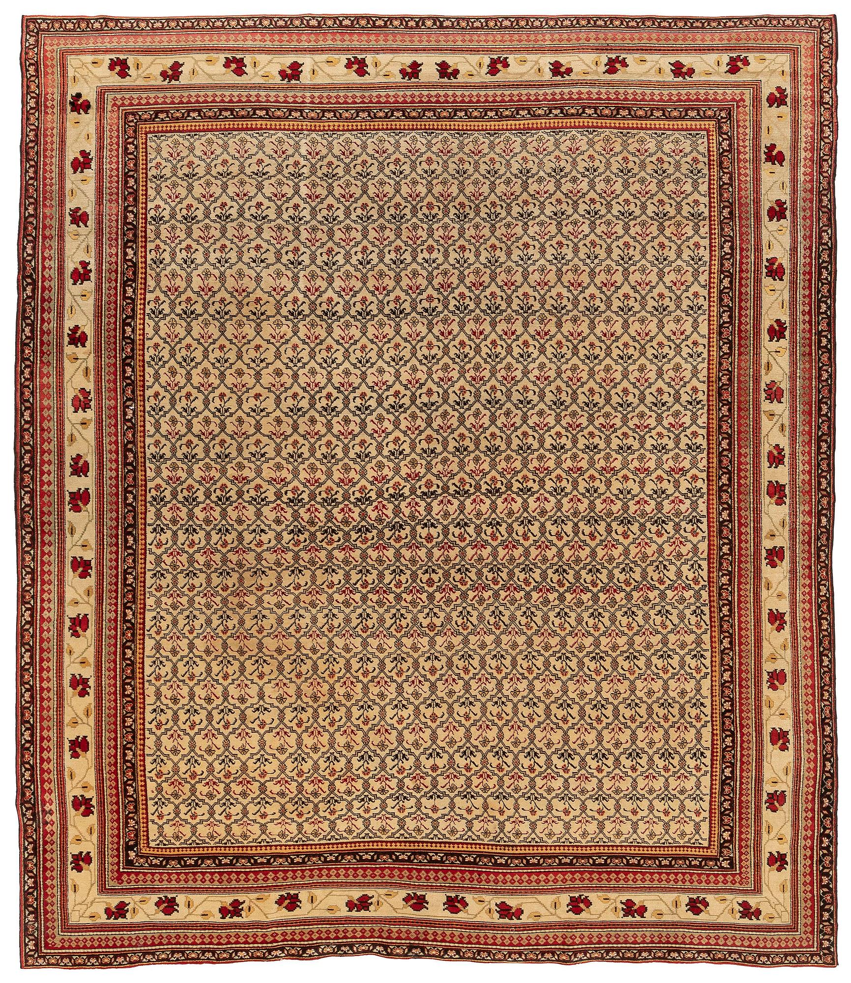 An antique Agra carpet Of Mughal 'Shrub' design, Northern India, c. 335 x 287 cm.