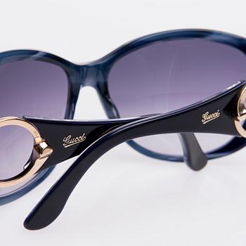 AURINKOLASIT, Gucci.