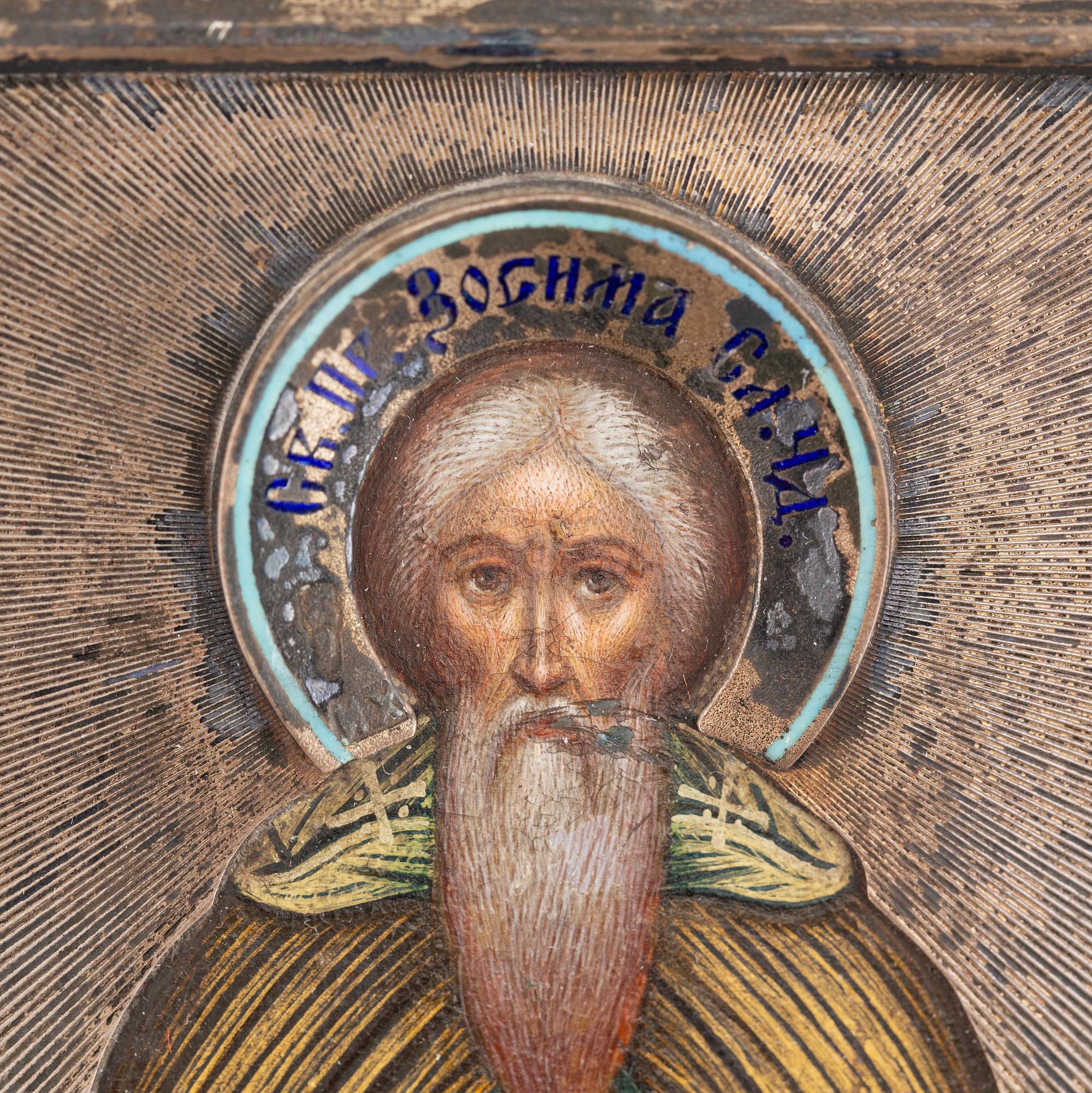A Russian travel icon, with oklad in silver and enamel, Moscow, 1908-1917.