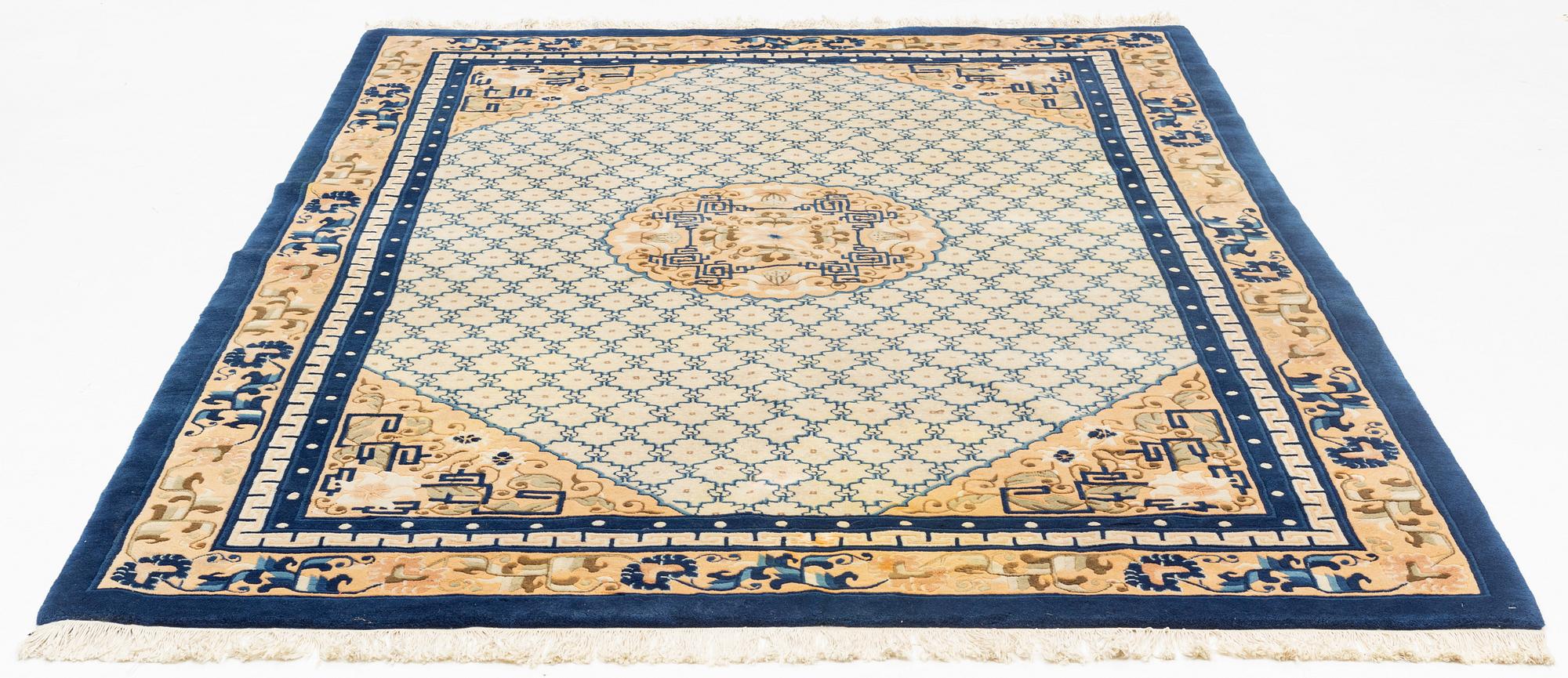 A carpet, China, antique finish, ca 275 x 185 cm.