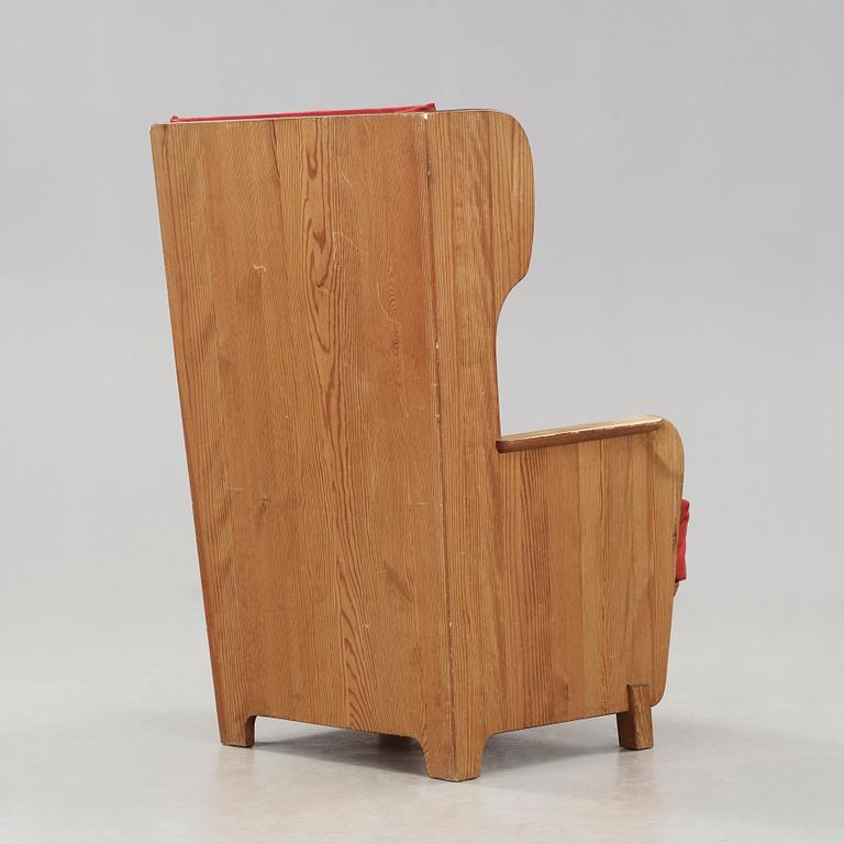 Axel Einar Hjorth, a 'Lovö' stained pine armchair, Nordiska Kompaniet, Sweden 1930's.