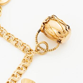 Bracelet, 18K gold bismarck link. With charms.