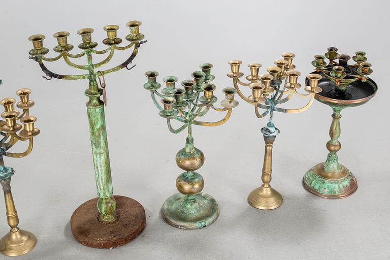 a metal sculpture group in eight parts, partly signed.
