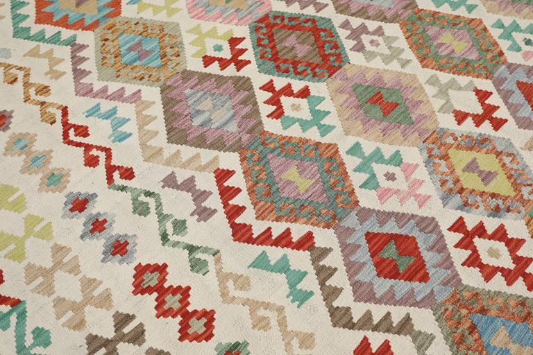 A Kilim rug, approx. 299 x 250 cm.