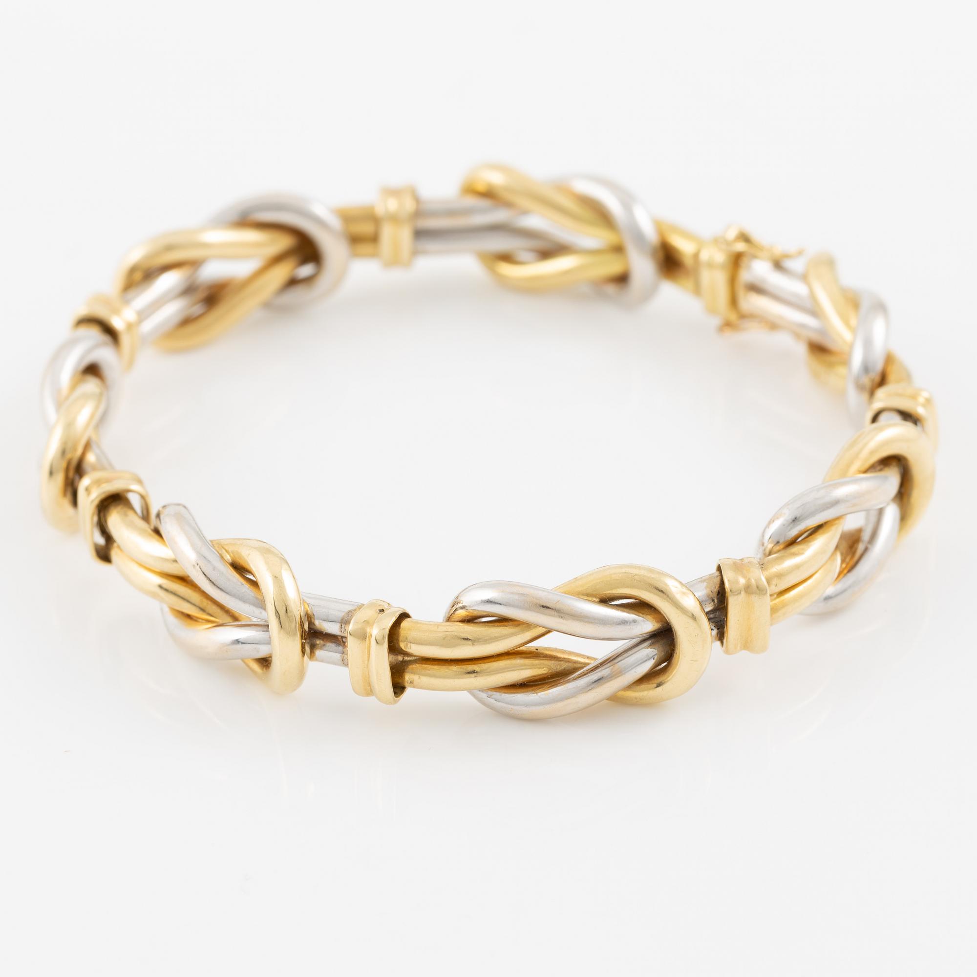 A bracelet in 18K gold and white gold.