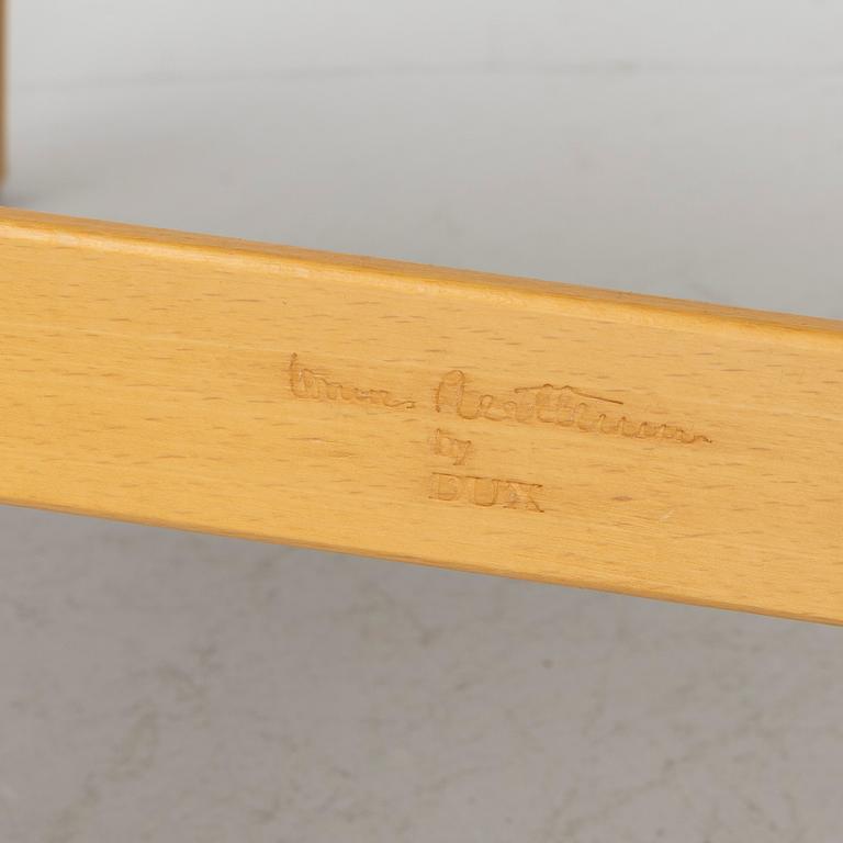 Bruno Mathsson, a pair of 'Eva' armchairs, DUX, Sweden, second half of the 20th century.