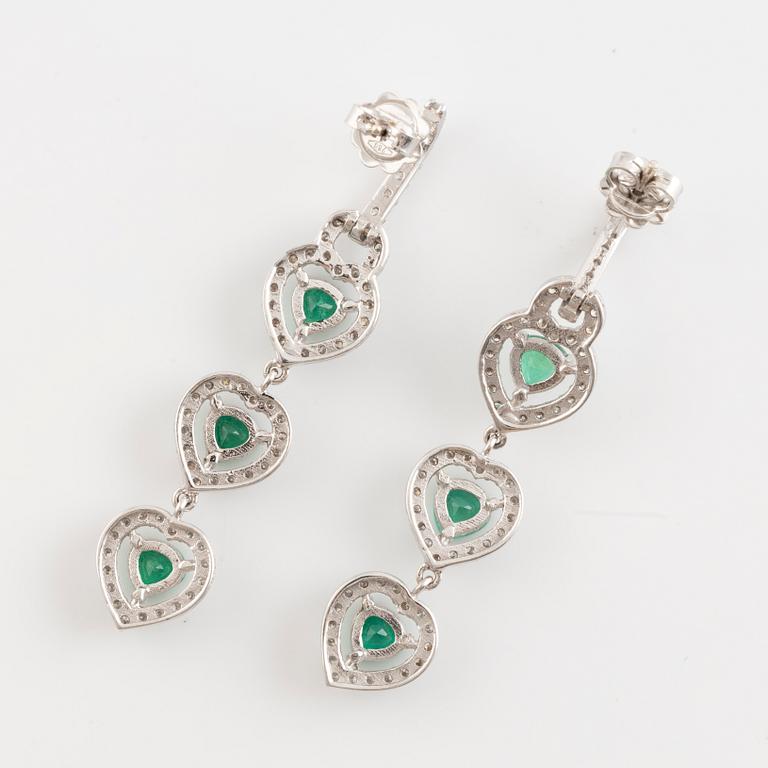 Emerald and brilliant cut diamond earrings.