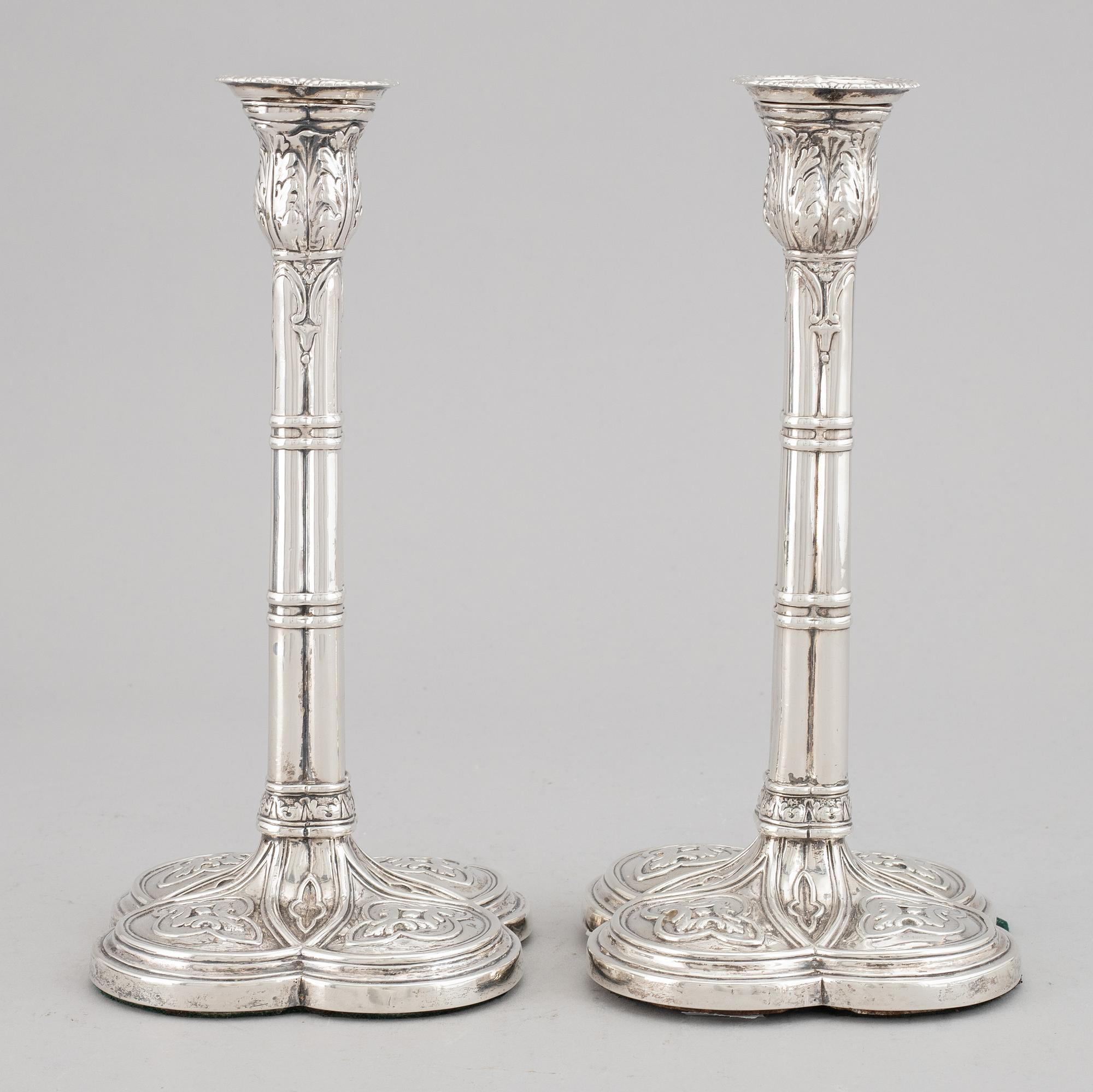 A pair of English 18th century silver candlesticks, marked JB, London 1766.