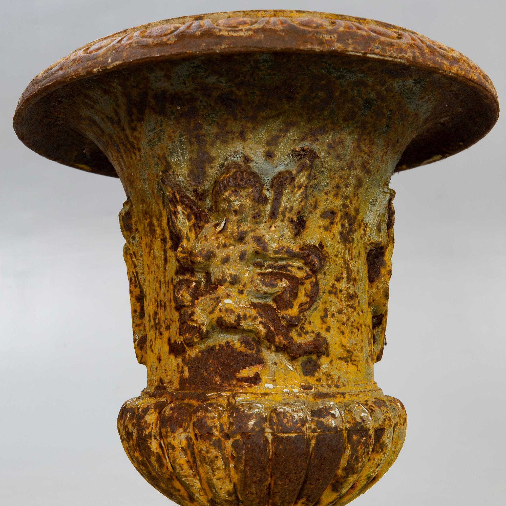 A pair of cast iron garden urns fist half of the 20th century.