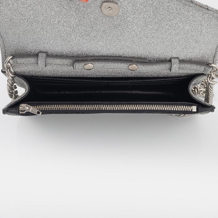 Balenciaga, a 'BB Round glitter bag'.