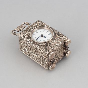 A rococo-style silver clock, mark of Henry Matthews, Chester 1903.