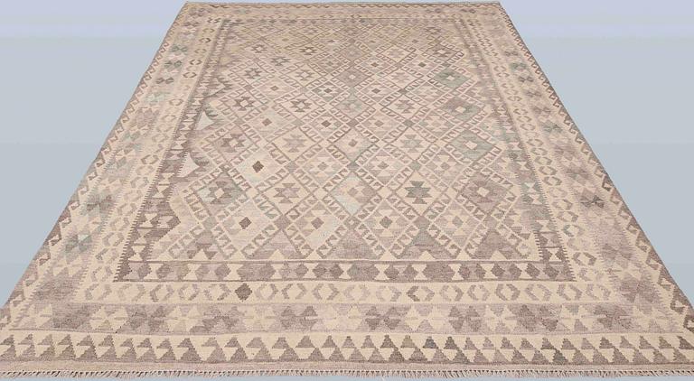 A Kelim carpet, 295 x 210 cm.