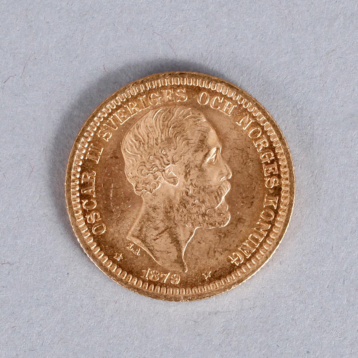GULDMYNT, 20 kronor, Oscar II, 1879. Vikt ca 9 gram.