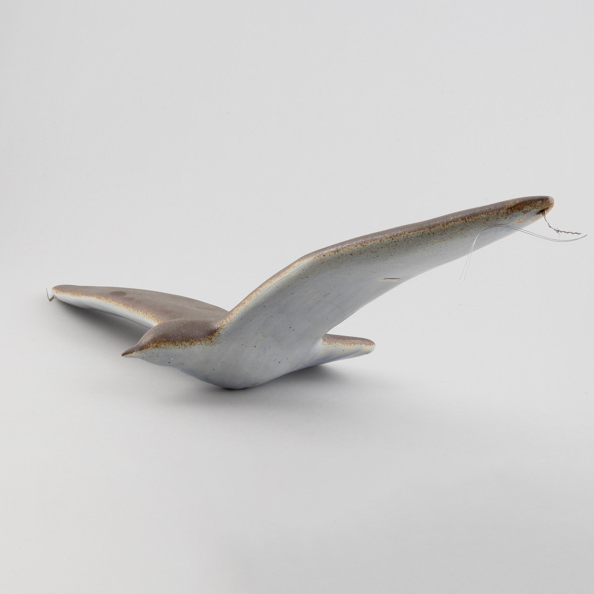 A stoneware sculpture of a sea bird, unsigned.