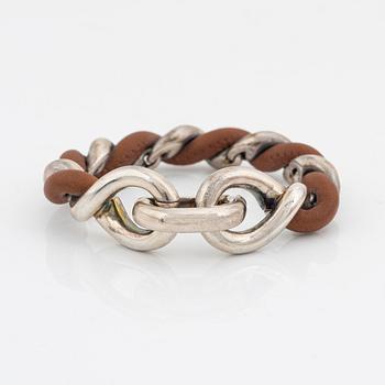 Hermès, a silver and leather bracelet, 2009.