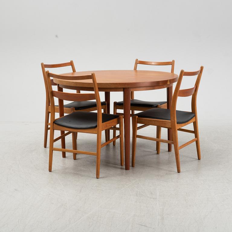 A five-piece teak and oak dining suite, second half of the 20th Century.