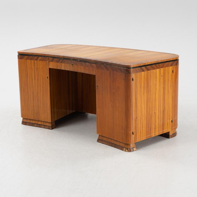 A zebrano veneered Swedish Modern desk, mid 20th Century.